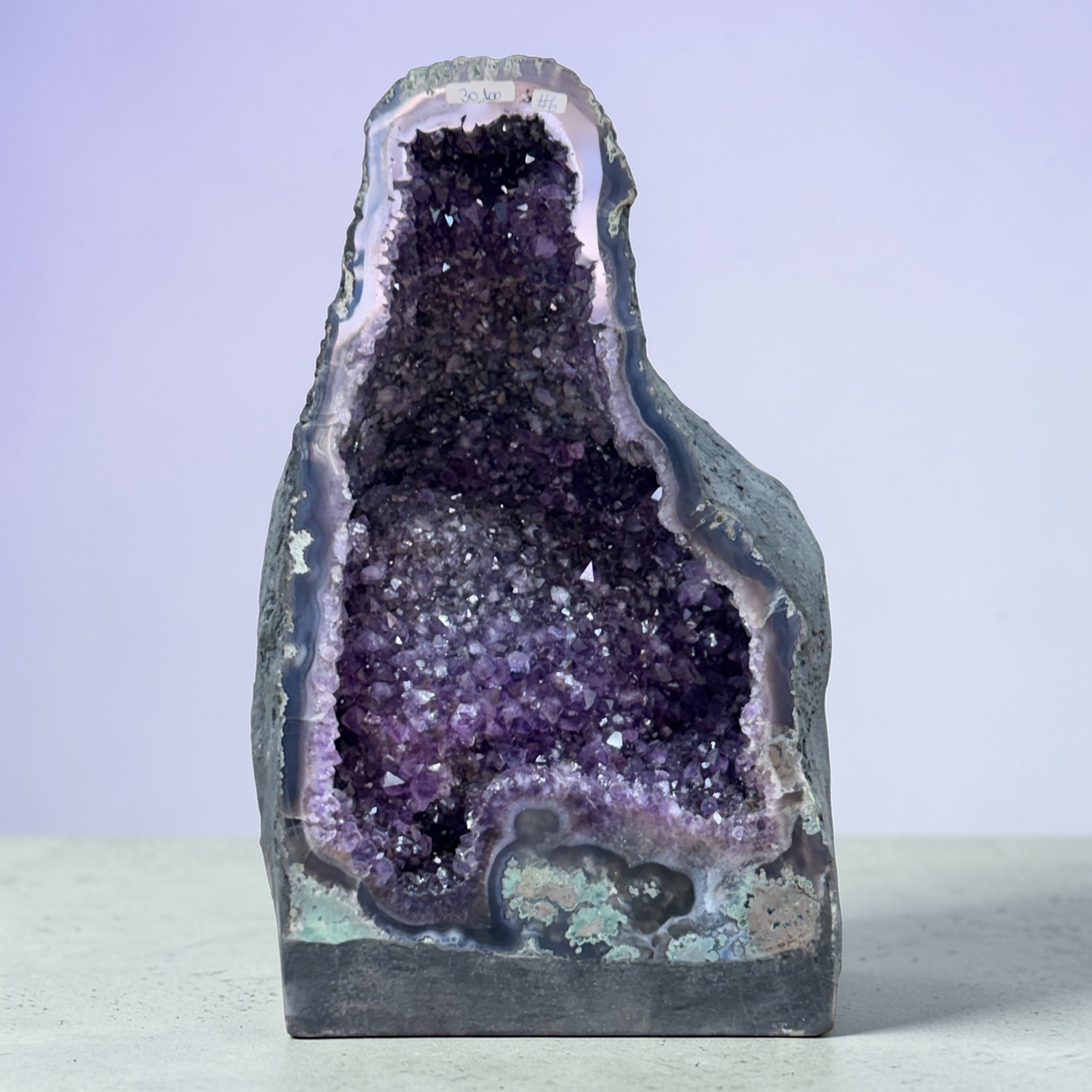 Natural Amethyst cave cluster with deep purple crystals and unique centre structure
