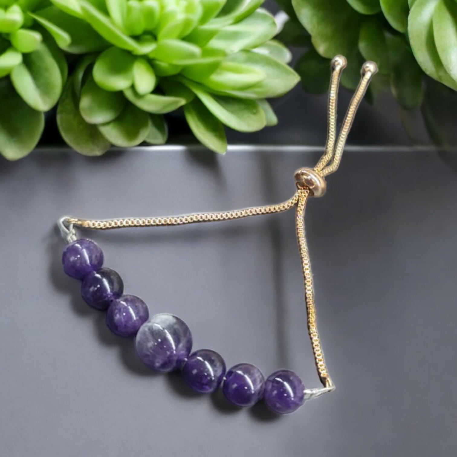 "Amethyst bracelet with 6pcs 8mm beads and 10mm centrepiece on flexible metal chain – elegant daily wear crystal jewellery"