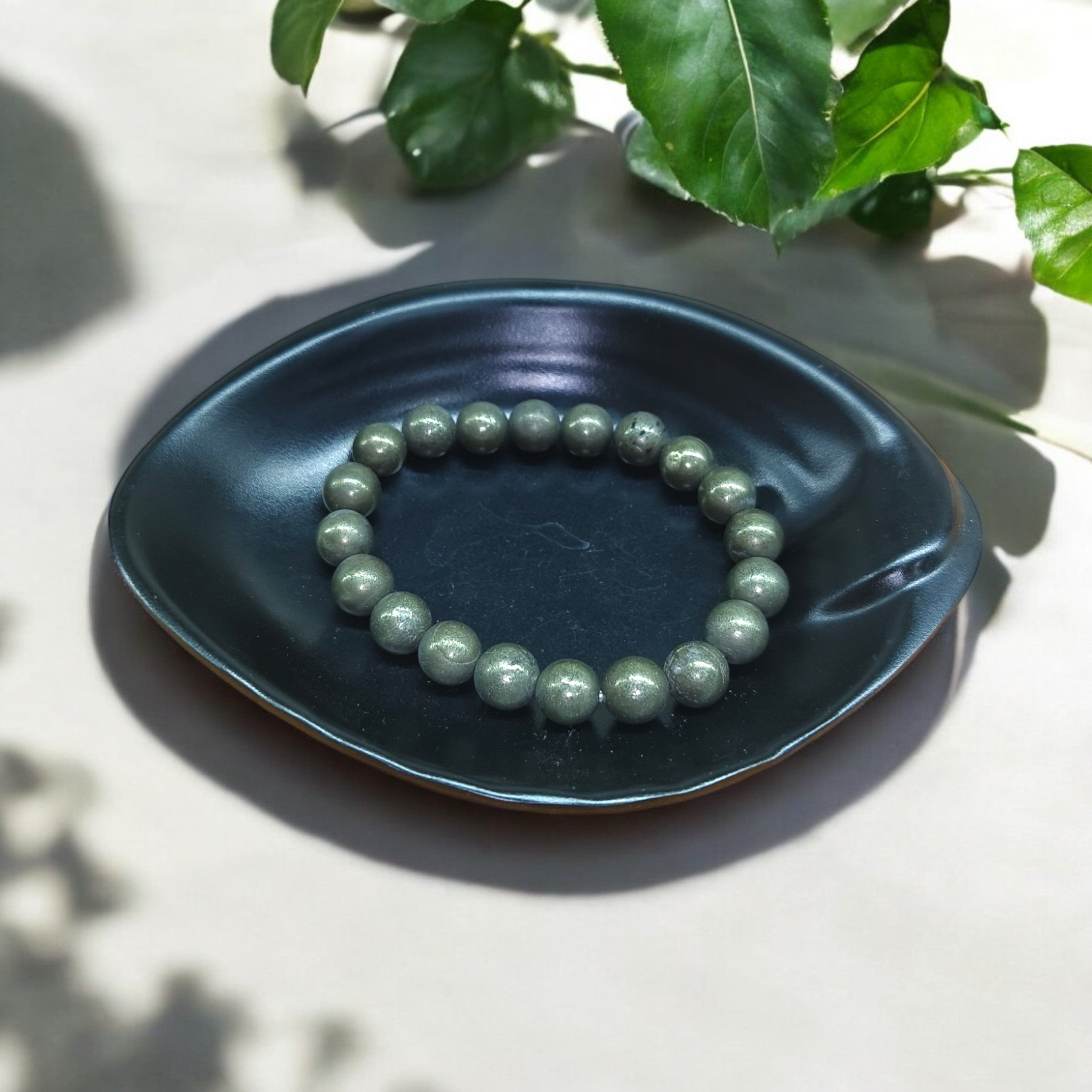 "Handcrafted Pyrite bracelet with 10 mm metallic stone beads"