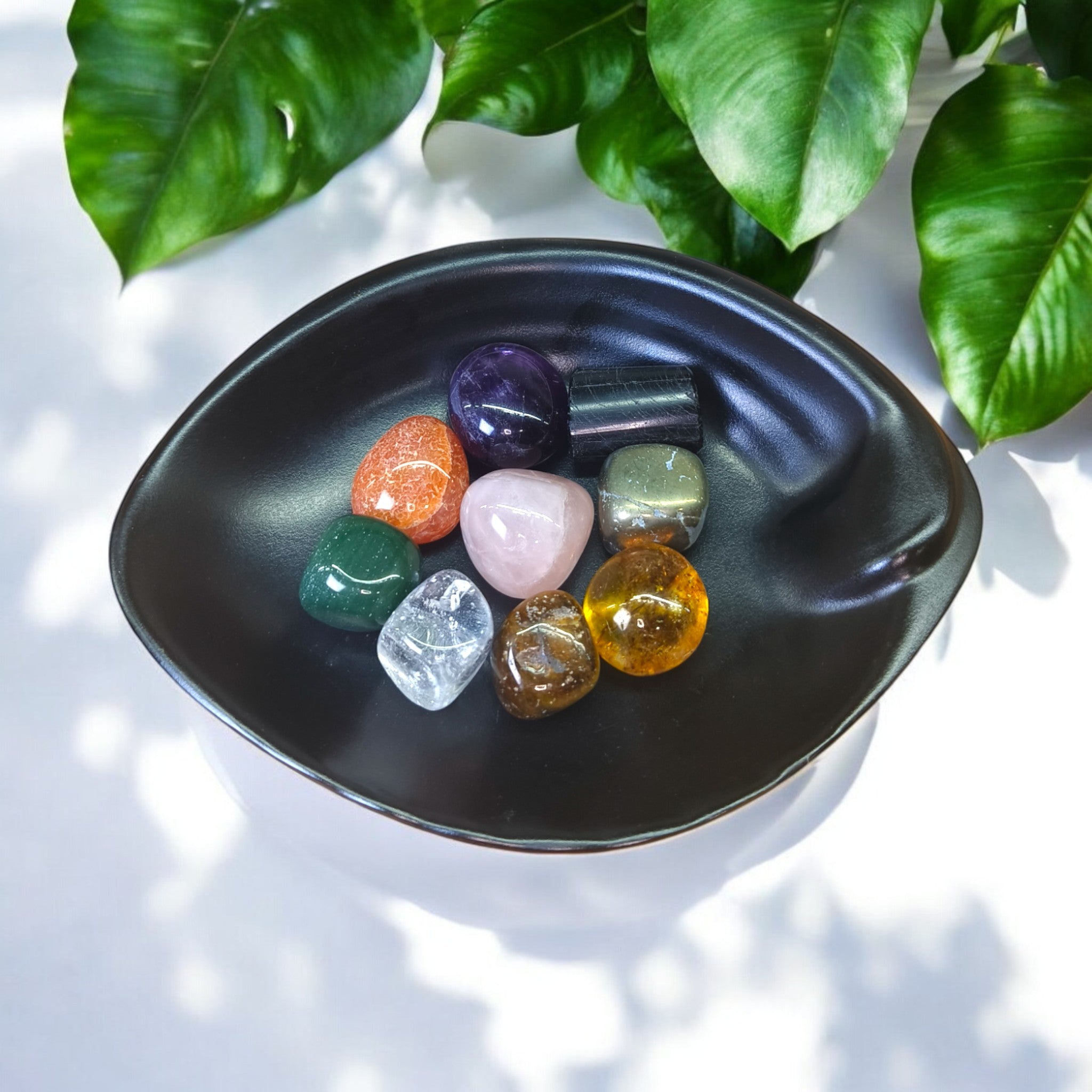 "Natural crystal tumble kit symbolizing grounding, clarity, and positive energy"